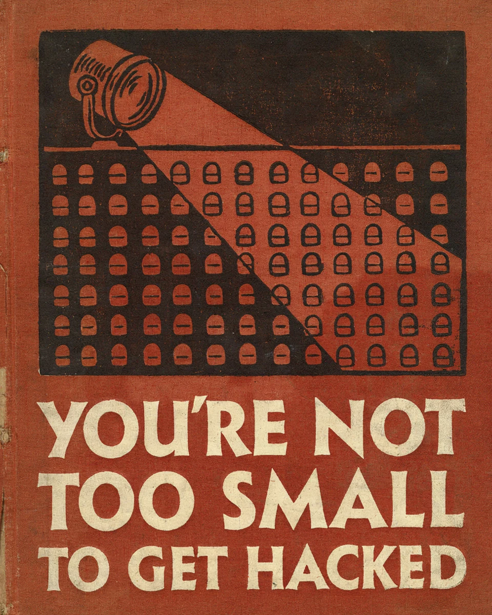 A worn vermilion cloth field manual with a searchlight woodcut and cream title lettering.