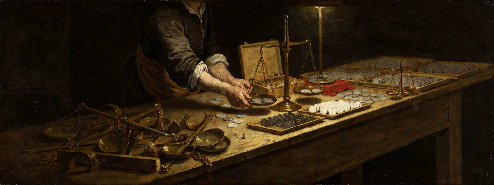 Craftsman's hands weighing plain metal tokens against master brass weights at a dark assay table, with sorted trays on one side and discarded brass frames on the other.