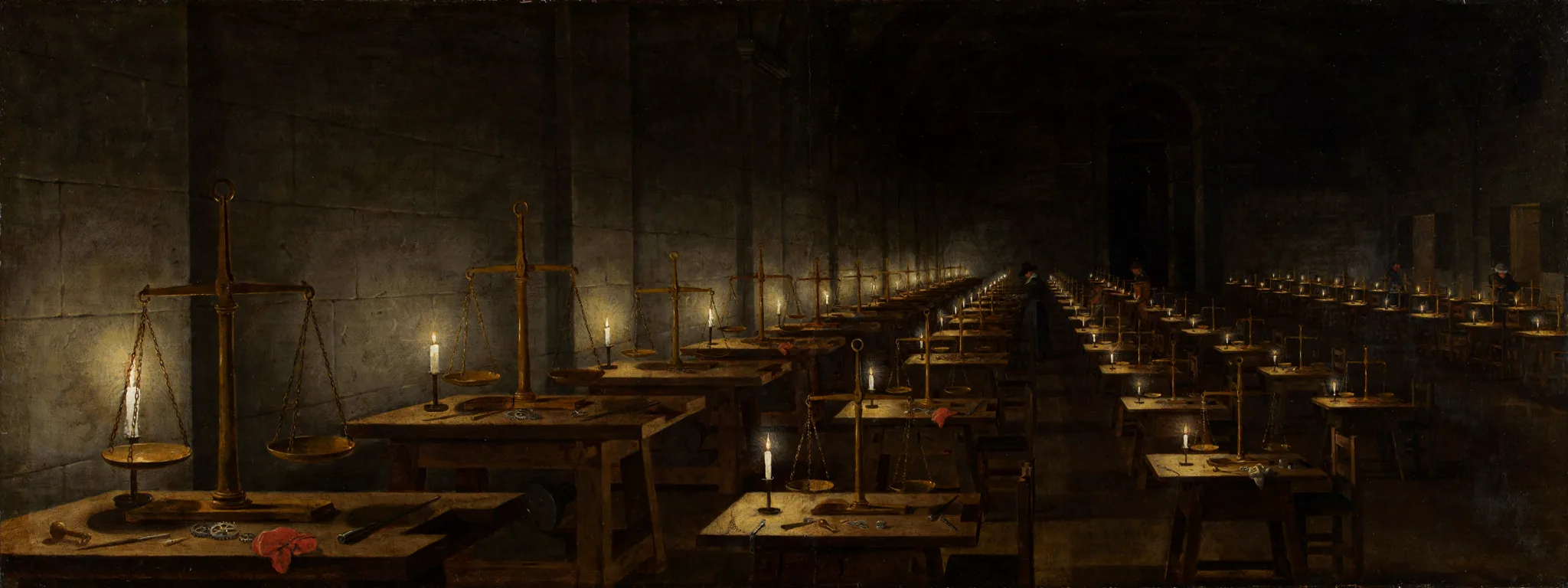 Candlelit workshop hall where one finished brass balance in the foreground is being copied on rows of benches receding into darkness.